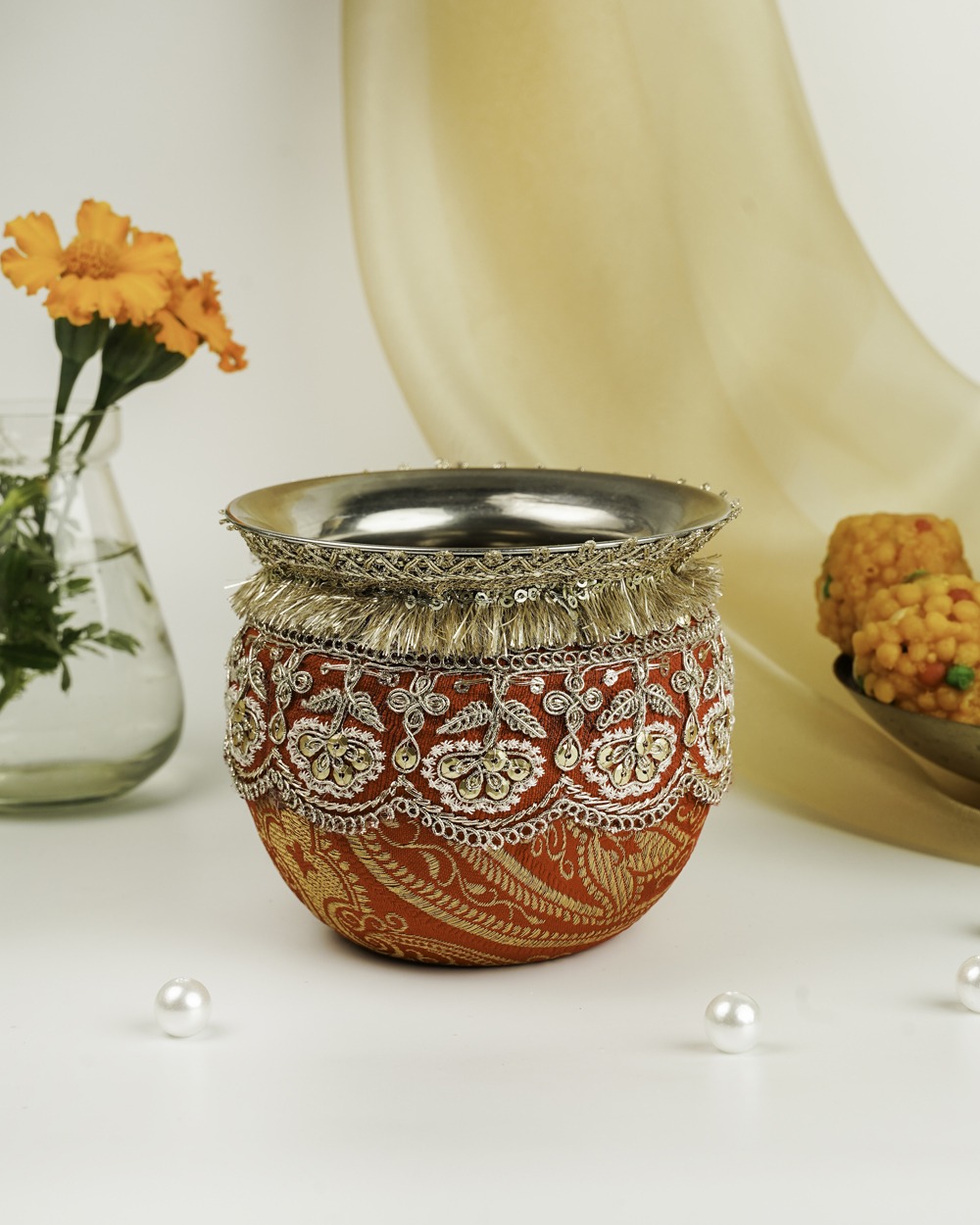 An ornate red Sindoori Brocade Gadvi by Navka Studio, with silver/gold embroidery, sequins, and a decorative fringe.