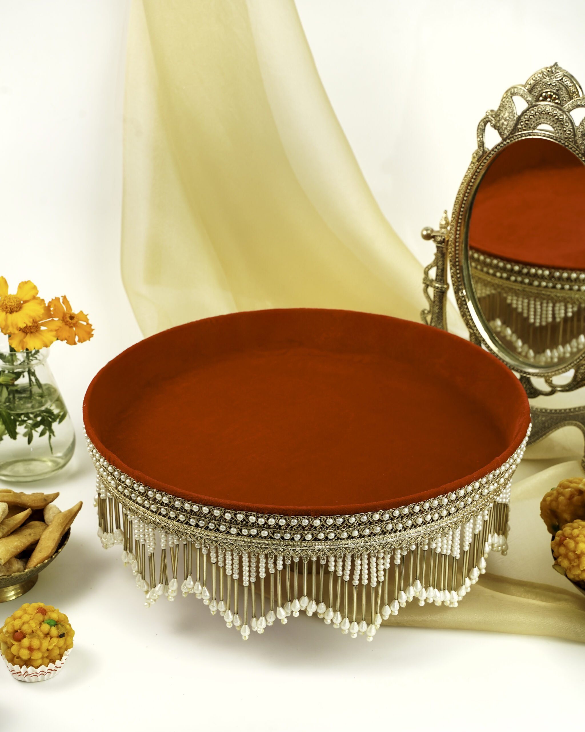 Elegant Sindoori Shagun Thaal by Navka Studio, featuring a rich red velvet base and intricate pearl and gold detailing, perfect for traditional ceremonies.