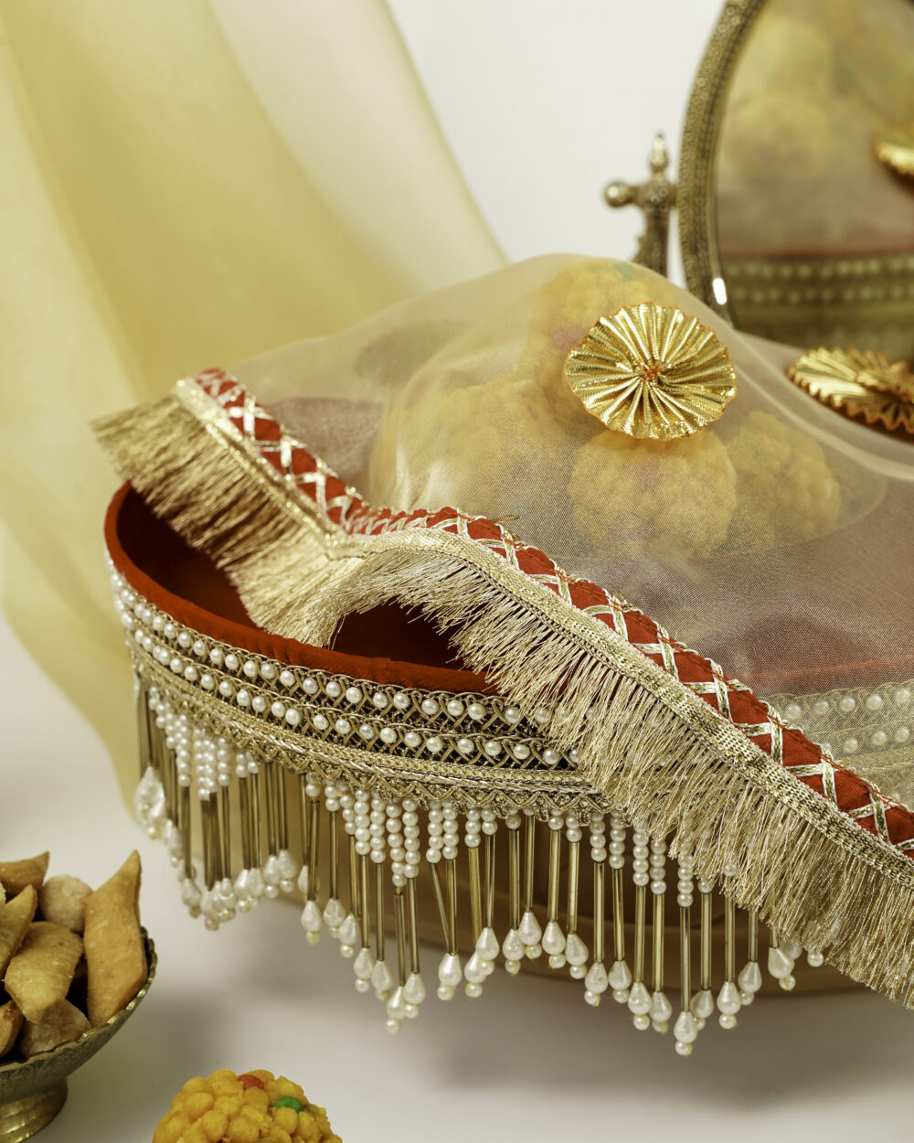 Sindoori Shagun Thaal with Cover by Navka Studio, beautifully decorated with pearls, golden fringe, and red velvet base, showcasing traditional Indian festive design.