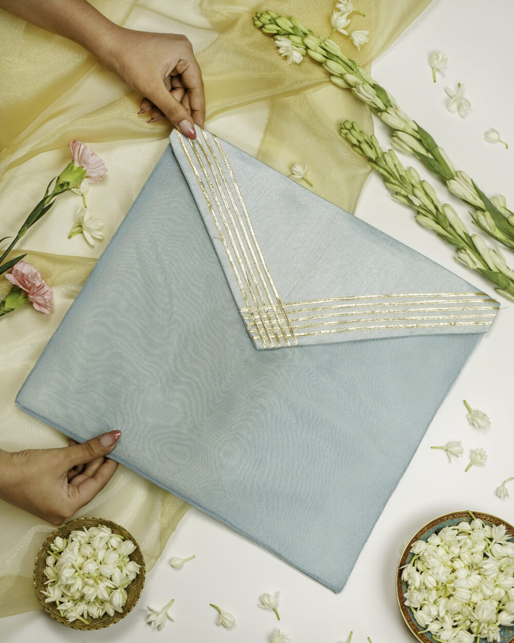 The Seher Silk Grid Gota work Trousseau Bag by Navka Studio, ideal for bridal trousseau storage.