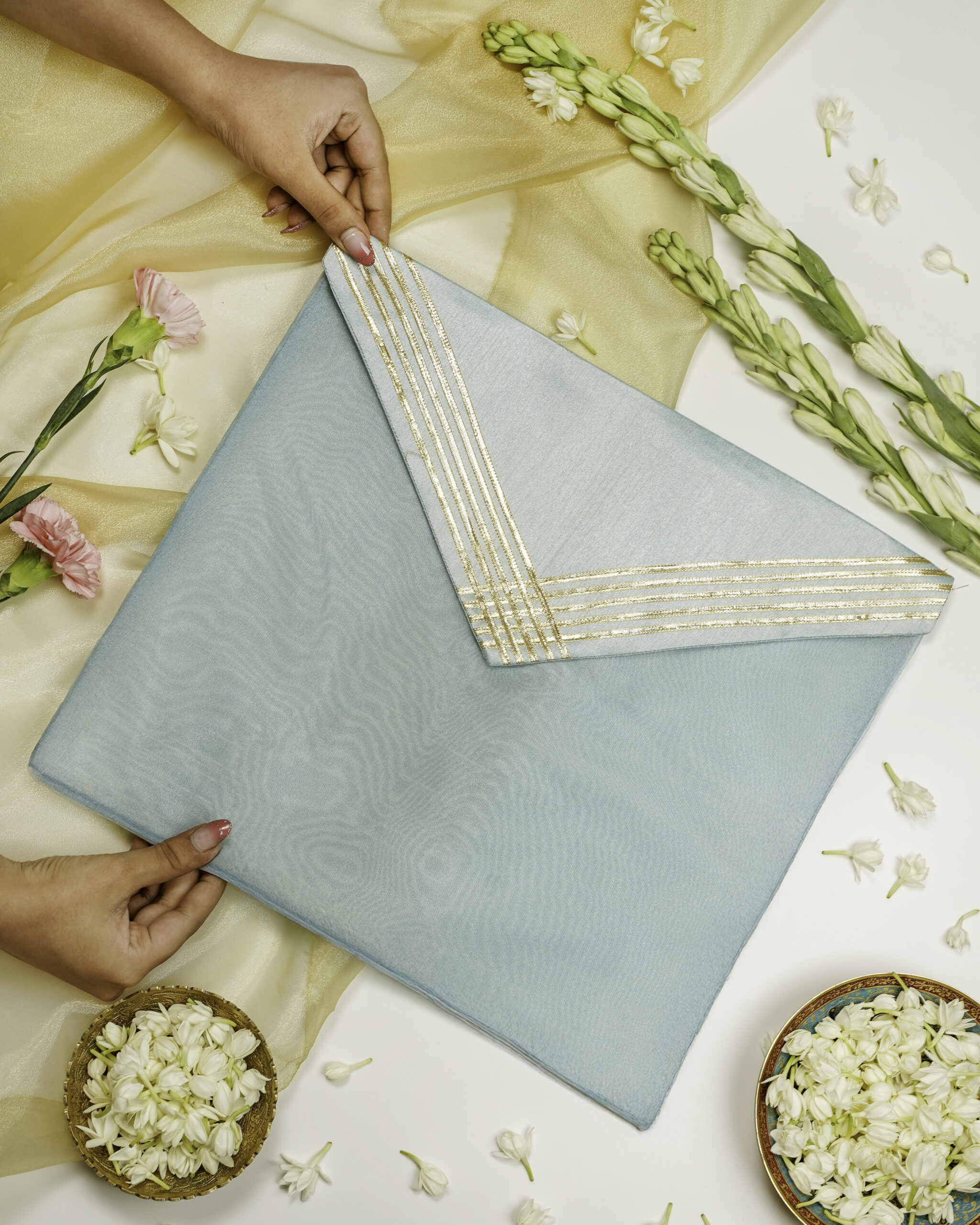 The Seher Silk Grid Gota work Trousseau Bag by Navka Studio, ideal for bridal trousseau storage.