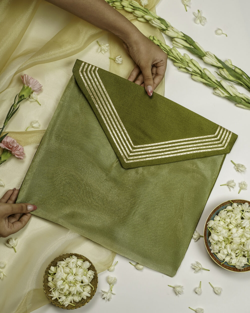 The Saawan Silk V Design Gota work with Gold trims Trousseau Bag from Navka Studio.