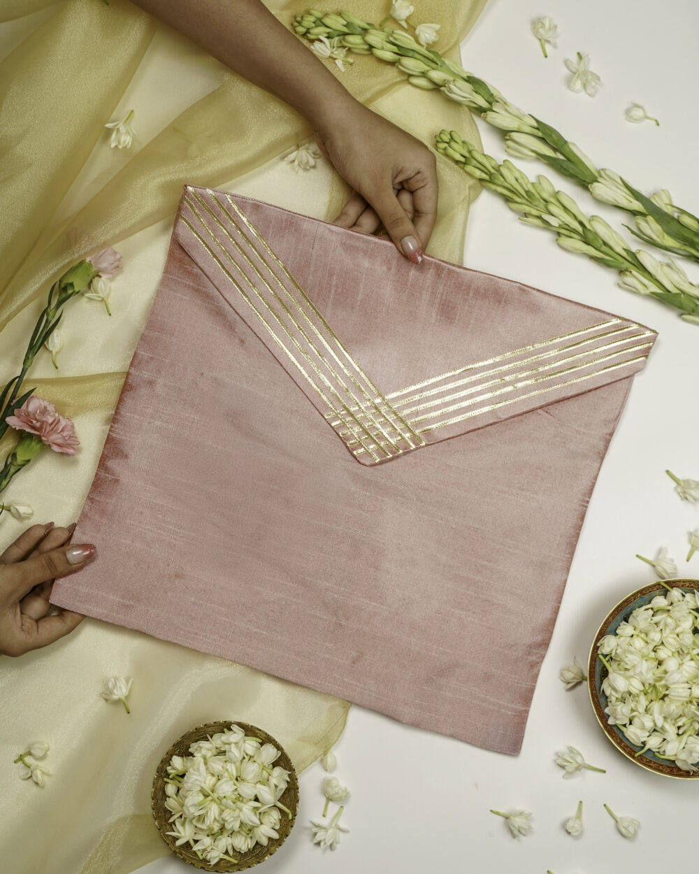 The Bahaar Silk Grid Gota work Trousseau Bag from Navka Studio, featuring a unique spring-themed grid pattern.