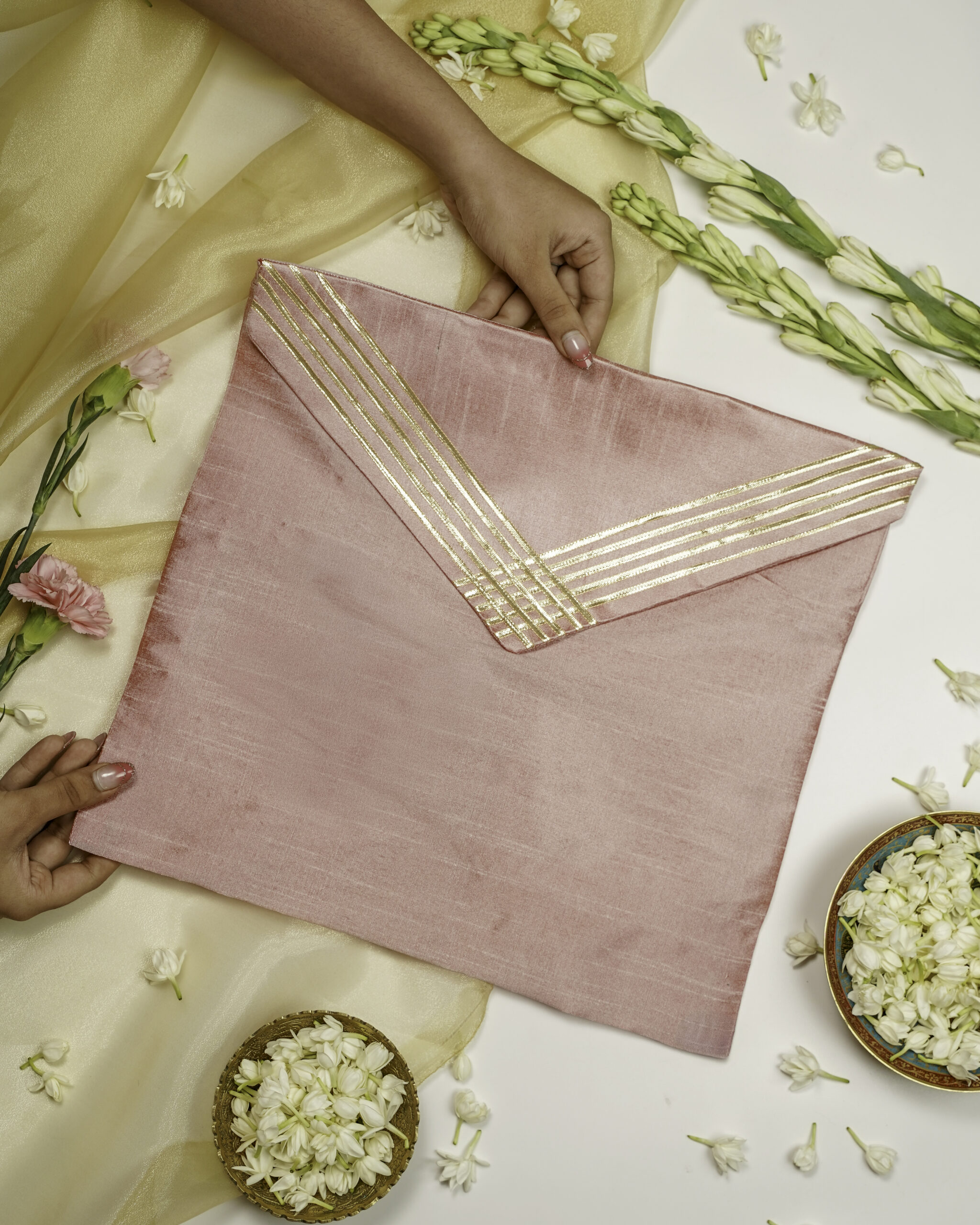 The Bahaar Silk Grid Gota work Trousseau Bag from Navka Studio, featuring a unique spring-themed grid pattern.