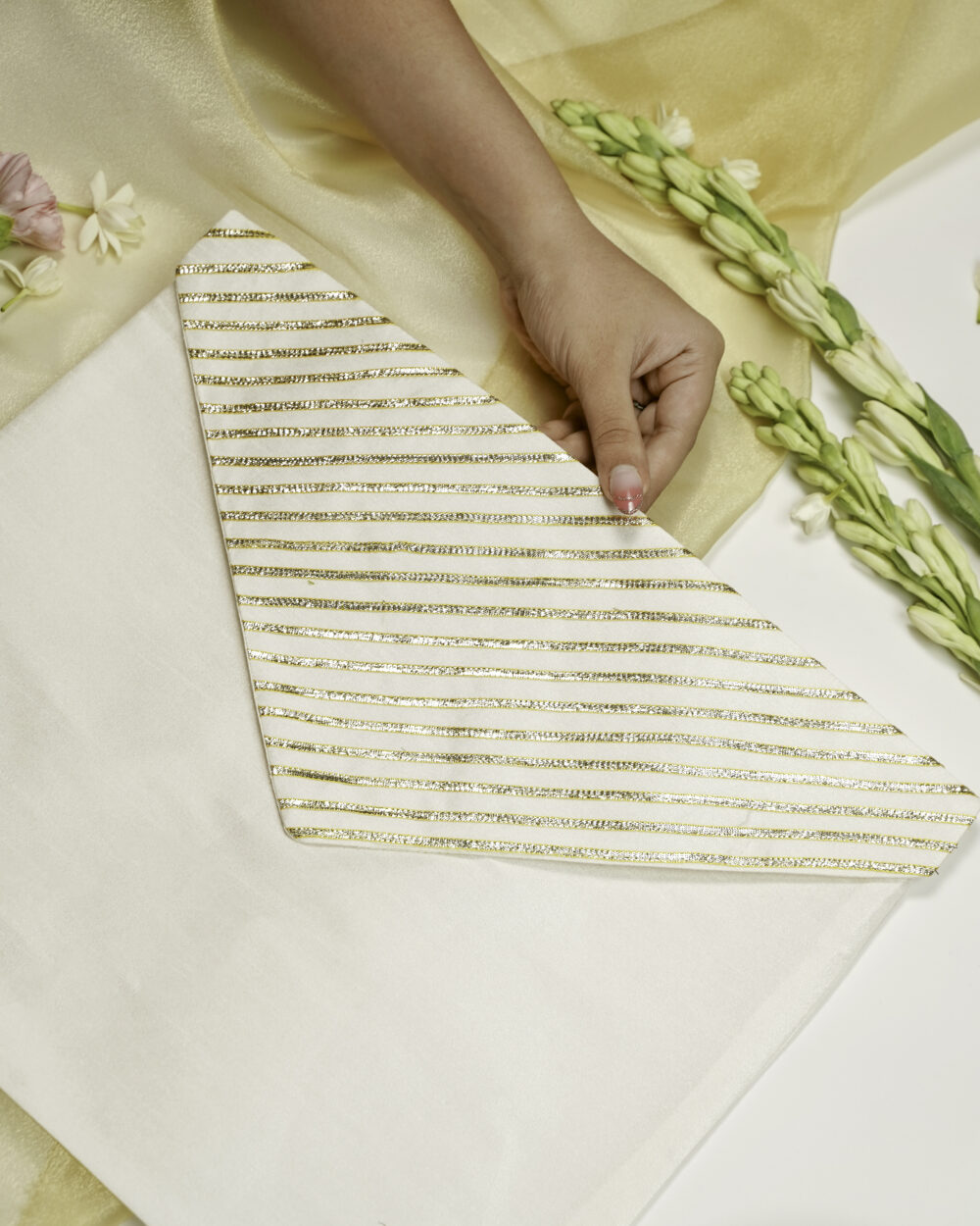 The vibrant Noori Silk Full Gota work with Gold trims Trousseau Bag from Navka Studio.