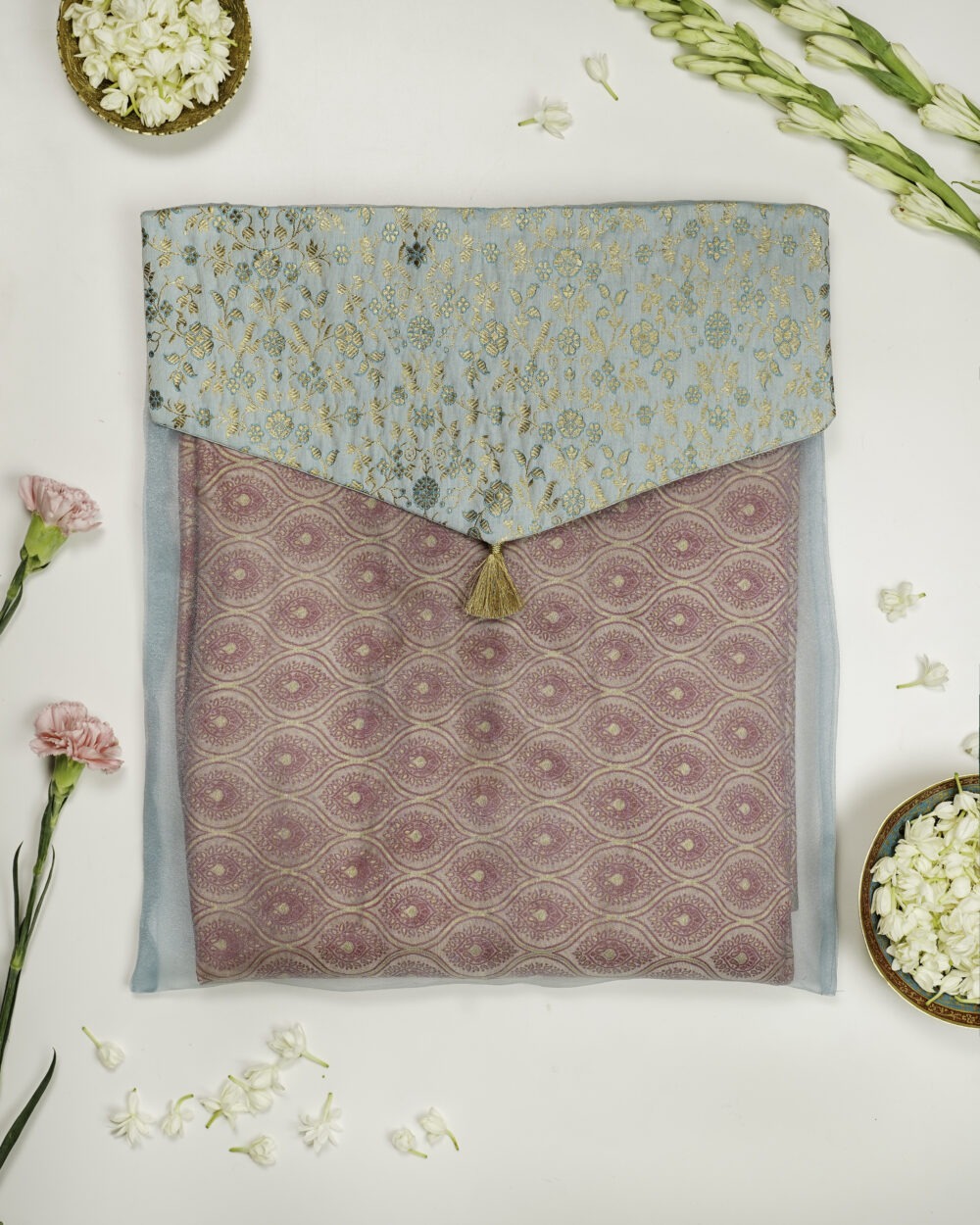 Navka Studio's Seher Brocade Silk & Organza Trousseau Bag in a light blue and gold theme.