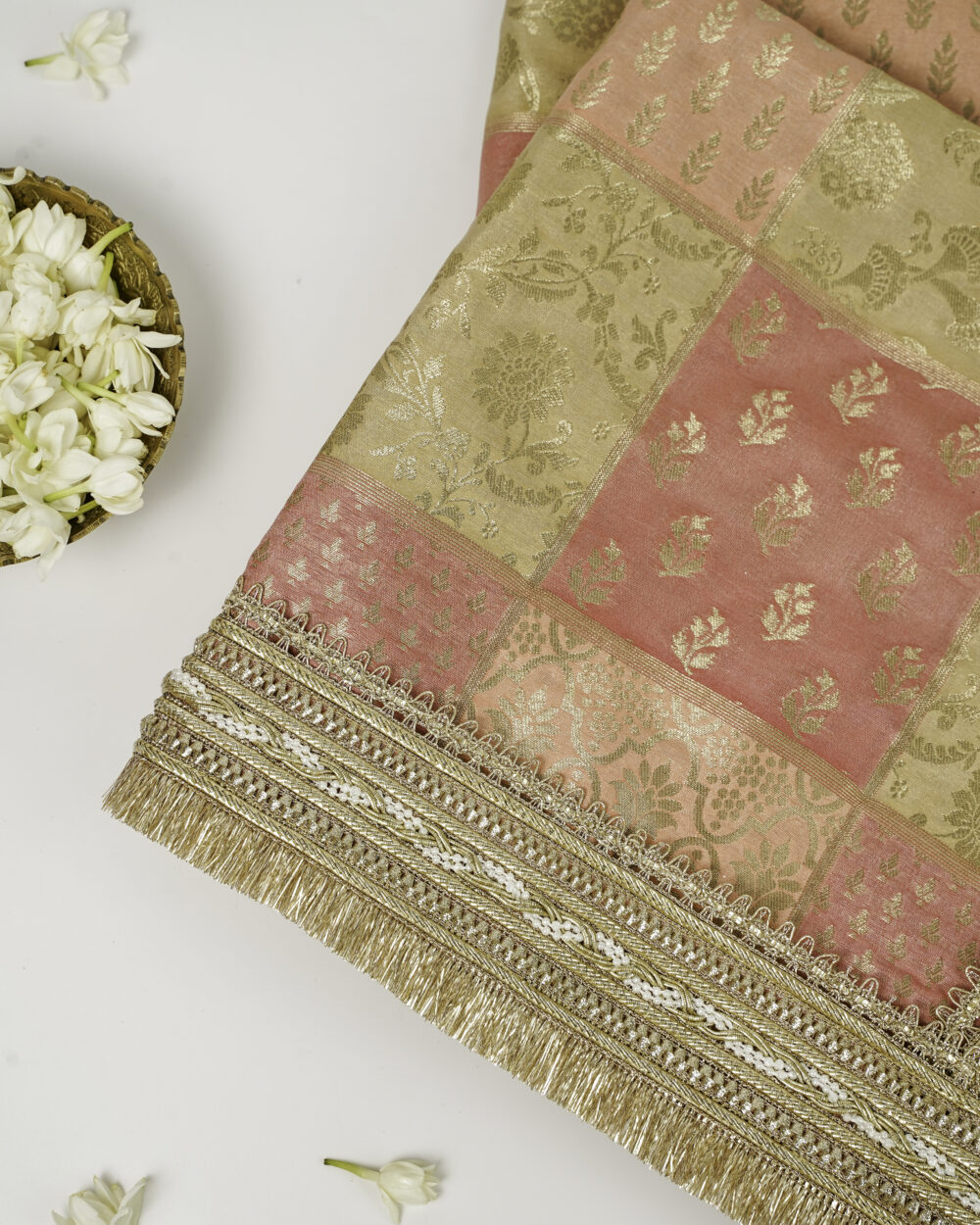 A close-up of the elegant Ibadat Rumala Sahib by Navka Studio, with its brocade fabric and detailed golden fringe.