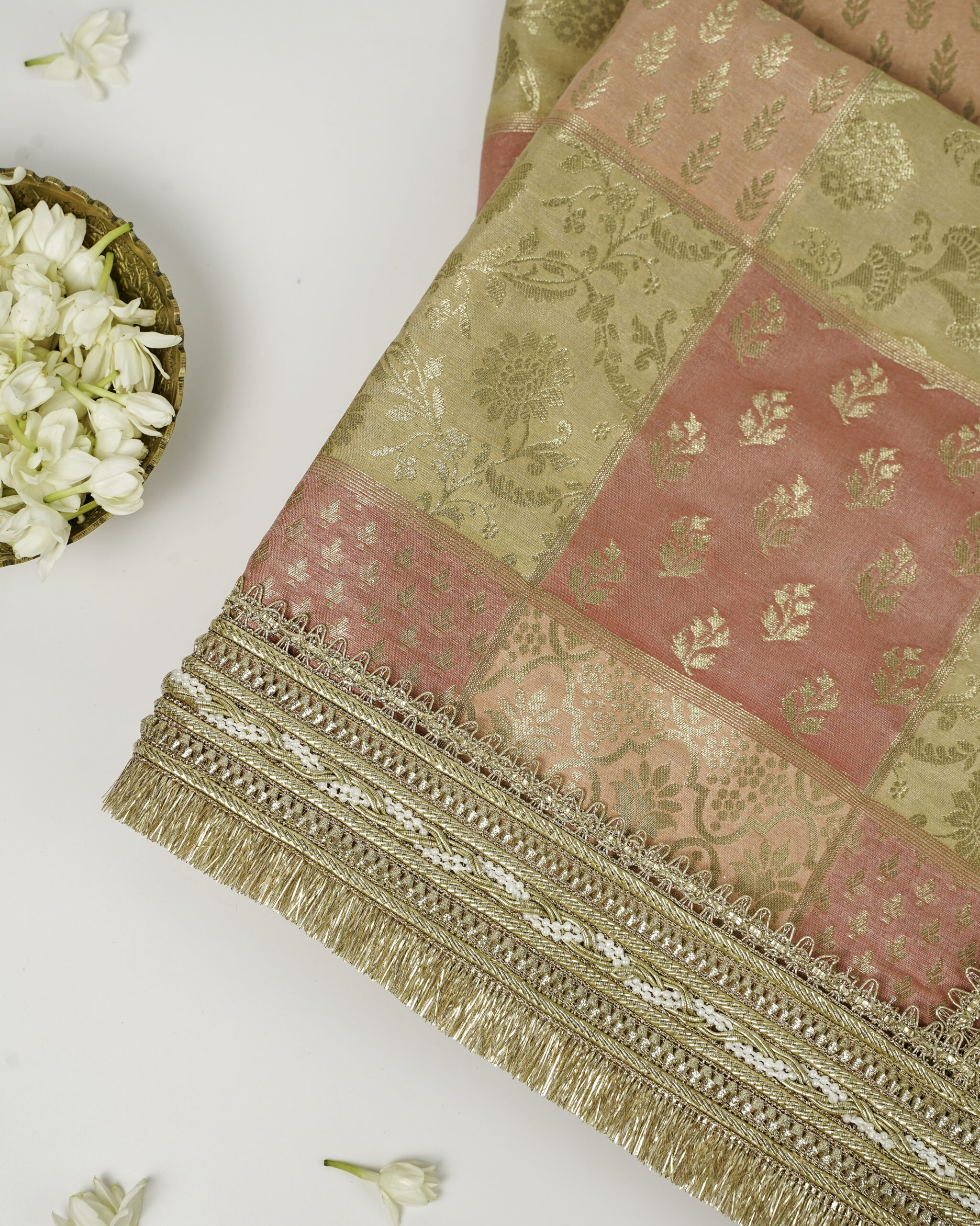 A close-up of the elegant Ibadat Rumala Sahib by Navka Studio, with its brocade fabric and detailed golden fringe.