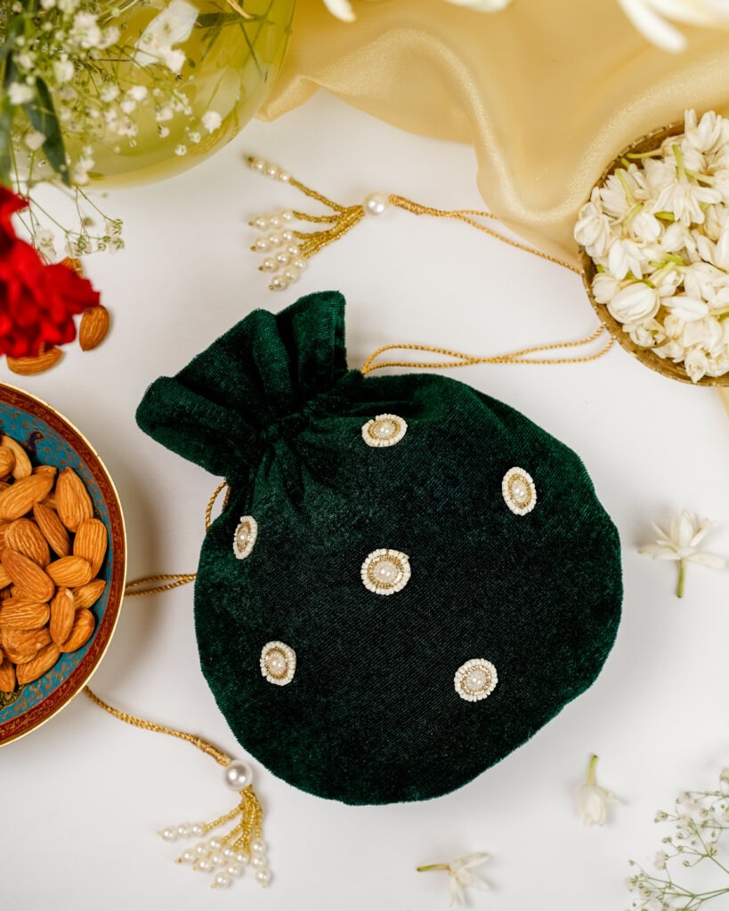 Navka Studio's Baagh Small Velvet Potli bag, featuring intricate floral embroidery on plush velvet fabric.