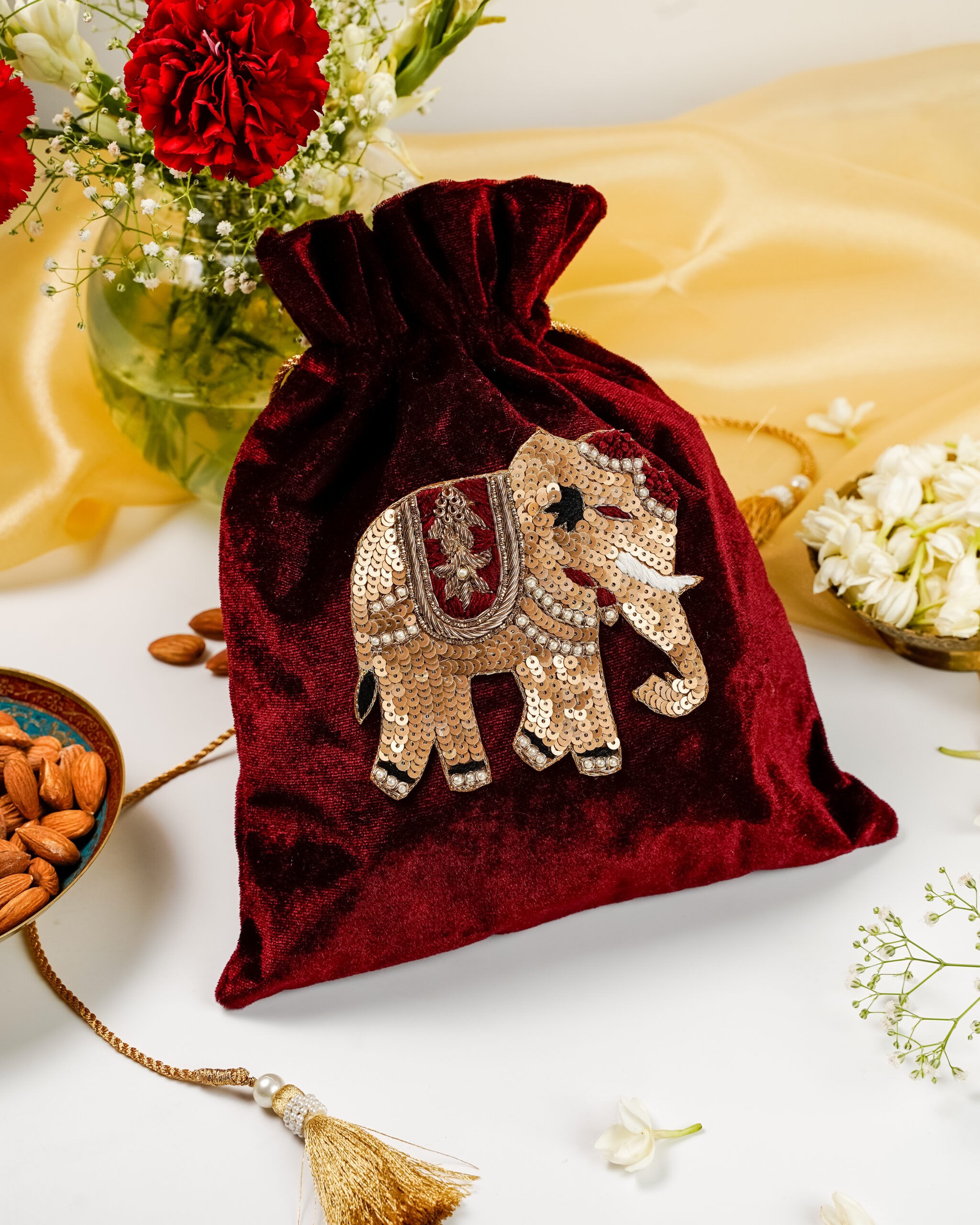 The unique Saaj Velvet Elephant Potli from Navka Studio, featuring an embroidered elephant design.