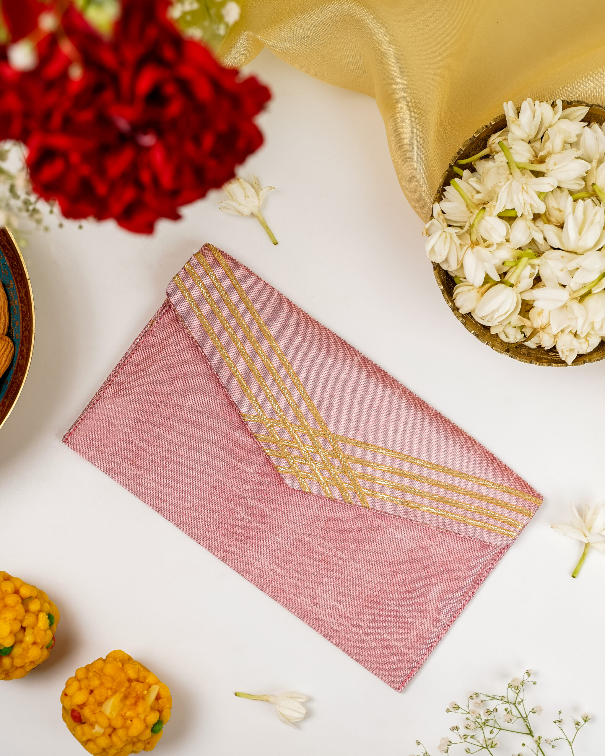 Navka's Bahaar Grid Gota Work Shagun Envelope in dusty rose pink with a gold gota grid design on the flap.