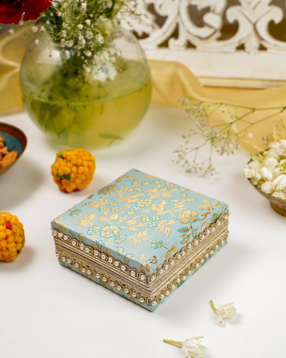 A light blue and gold Navka Seher Single Brocade Kada Box, designed for storing bridal jewellery and heirlooms.