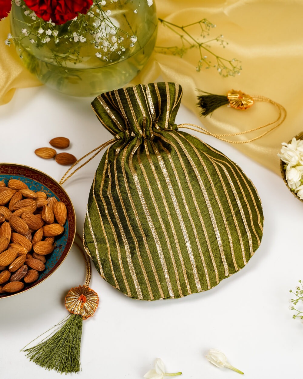 The Saawan Silk & Gota Work Potli by Navka Studio, featuring a monsoon-inspired design with detailed embroidery.